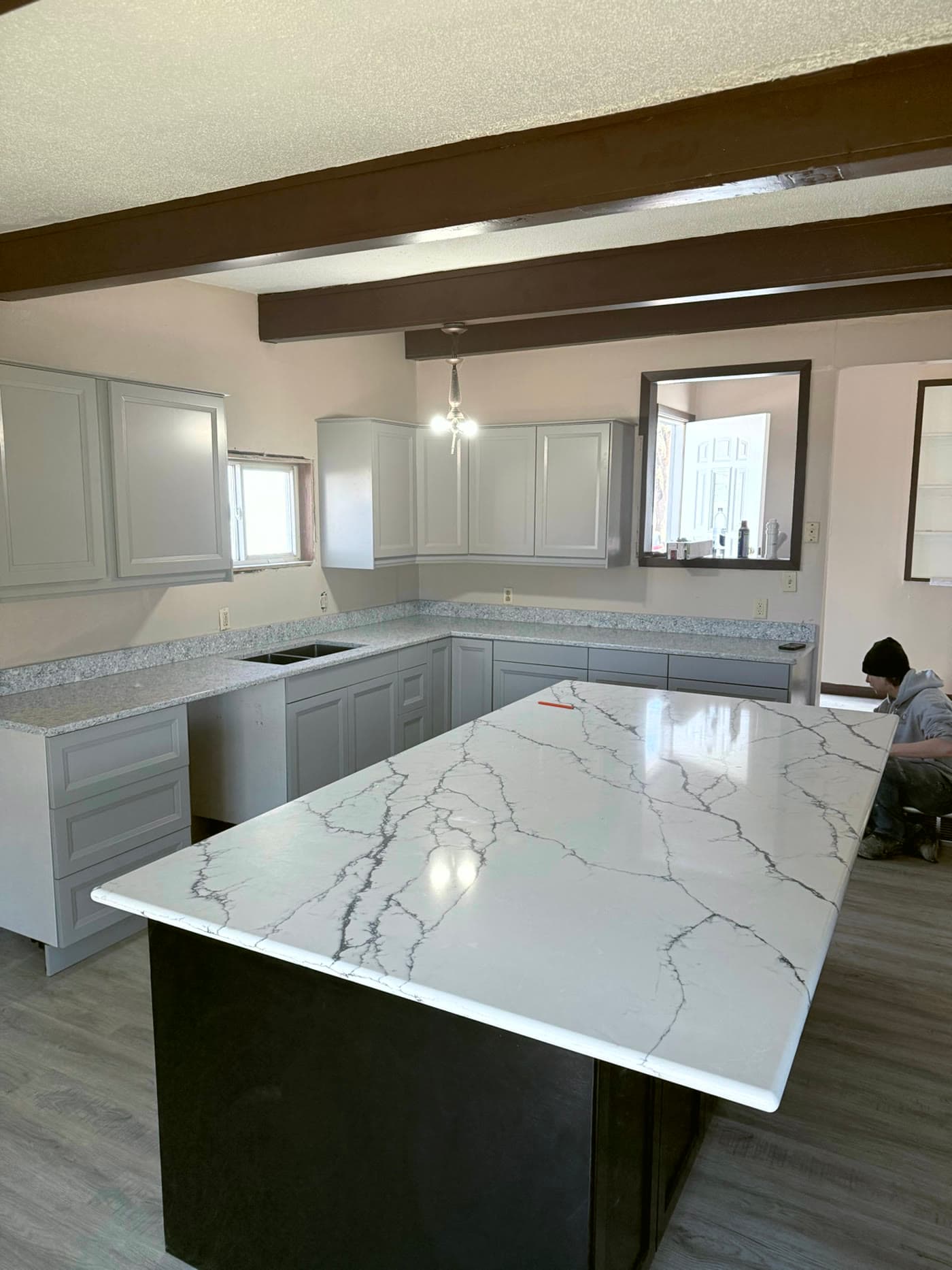 Remodeled kitchen with quartz island countertop